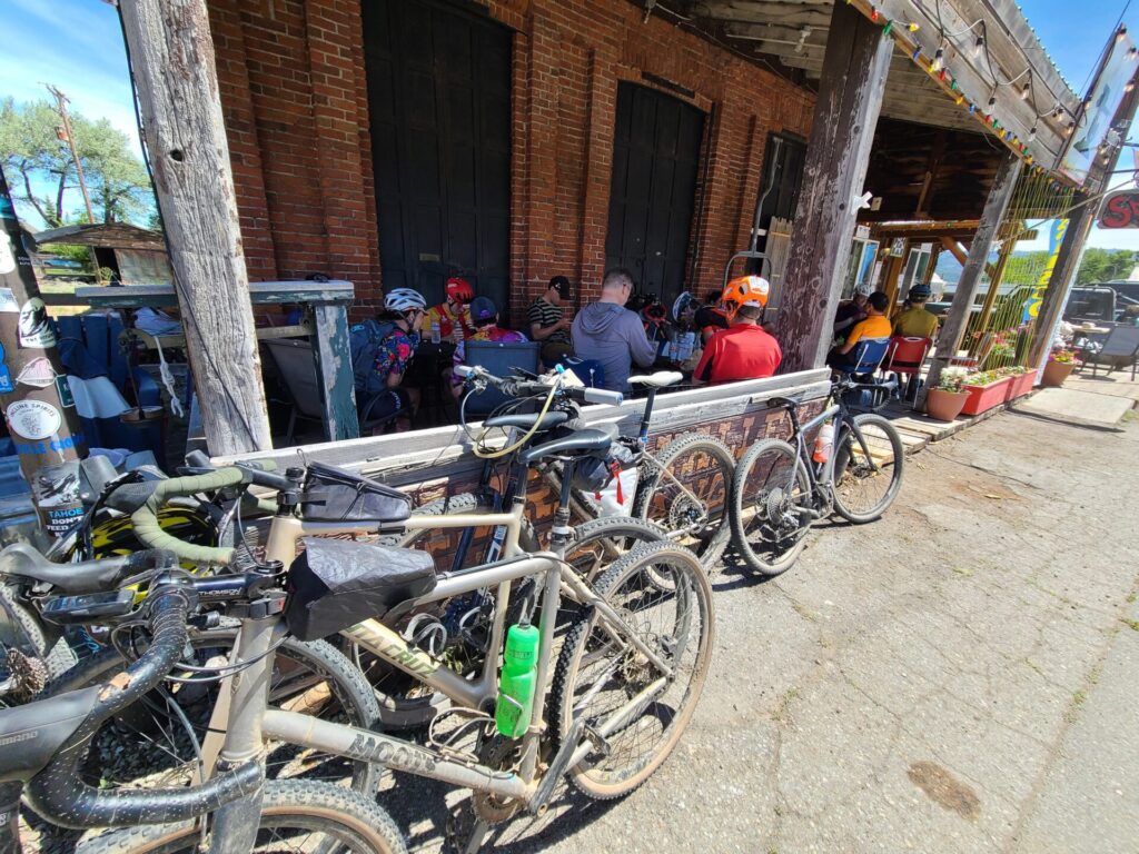 Gravel bikes parked outside a restaurant lunch stop during the Gravel Social