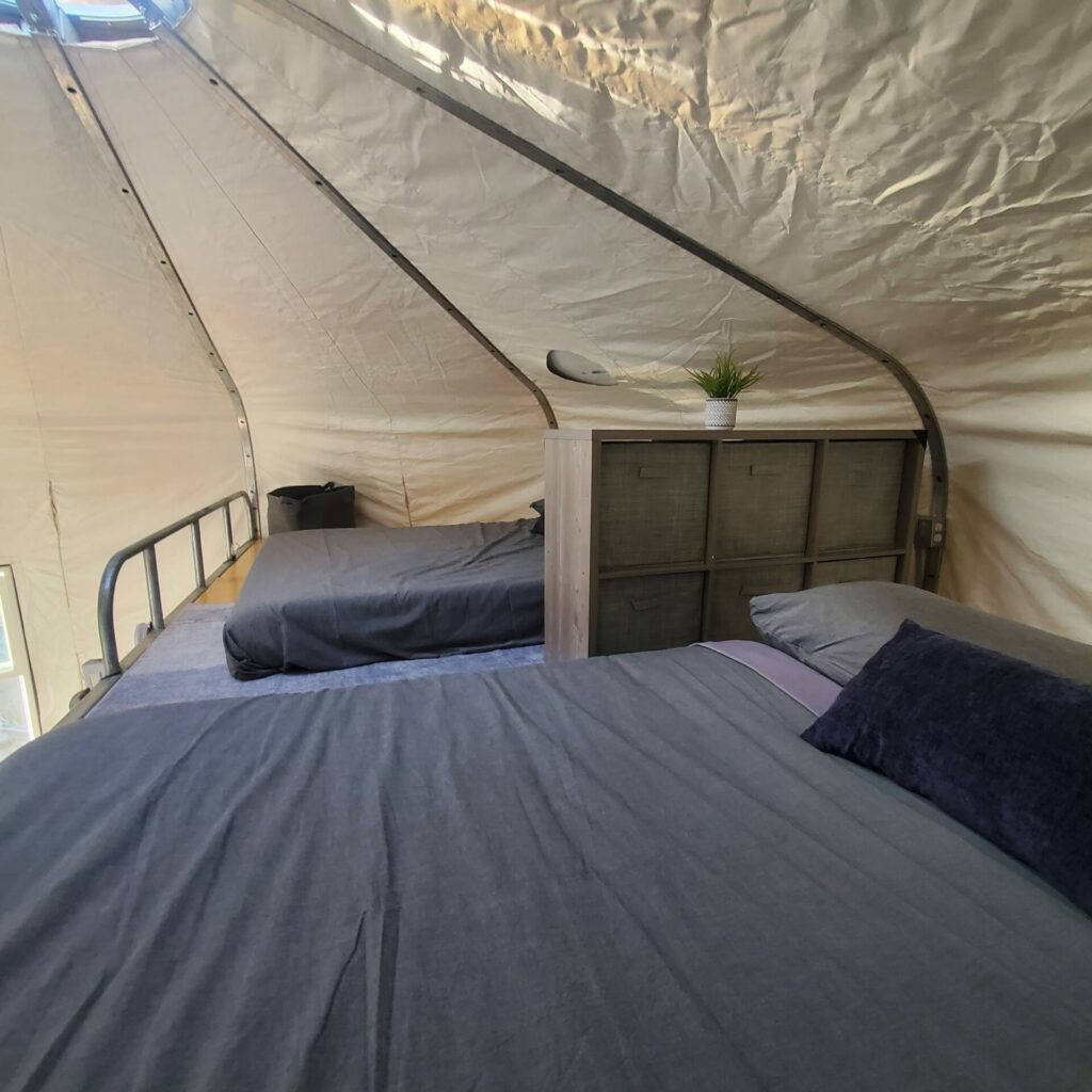 Yurt loft with two full beds at High Camp