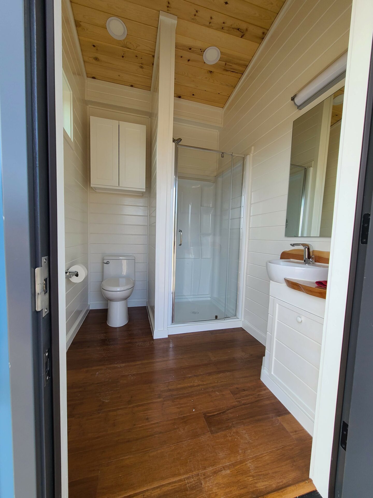 Shared bathhouse with private shower stalls at Beckwourth Peak High Camp