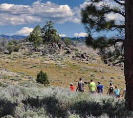 Hikers on a trail near Beckwourth Peak High Camp in the Lost Sierra